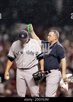 NO FILM, NO VIDEO, NO TV, NO DOCUMENTARY - A trainer applies bug spray to New York Yankees pitcher Joba Chamberlain in the eighth inning during Game 2 of an American League Division Series at Jacobs Field in Cleveland, OH, USA on October 5, 2007. Photo by Phil Masturzo Jr /Akron Beacon Journal/MCT/Cameleon/ABACAPRESS.COM Stock Photo