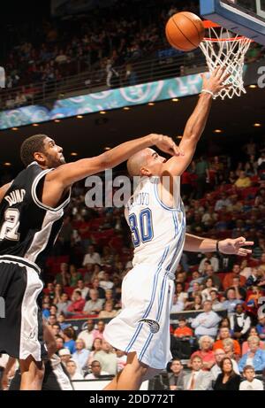 NO FILM, NO VIDEO, NO TV, NO DOCUMENTARY - Orlando Magic guard Carlos Arroyo drives past San Antonio Spurs forward Tim Duncan at Amway Arena in Orlando, Florida, USA, on October 25, 2007. The Magic defeated the Spurs 99-90. Photo by Gary W. Green/Orlando Sentinel/MCT/Cameleon/ABACAPRESS.COM Stock Photo