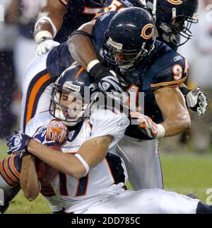 Nov 05, 2006; Chicago, IL, USA; Miami Dolphinns at Chicago Bears NFL  football game. Bears #94 Brendon Ayanbadejo talks with Nick Saban and Randy  McMichael after the game. Mandatory Credit: Photo by