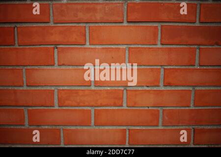 orange brick wall outdoor with grey seams. Stock Photo
