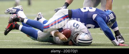 NO FILM, NO VIDEO, NO TV, NO DOCUMENTARY - Dallas Cowboys quarterback Tony Romo (9) is hit after a scramble by New York Giants linebacker Antonio Pierce during an NFC Divisional playoff game in Irving, TX, USA on January 13, 2008. The Giants defeated the Cowboys, 21-17, at Texas Stadium. Photo by Ron Jenkins/Fort Worth Star-Telegram/MCT/Cameleon/ABACAPRESS.COM Stock Photo