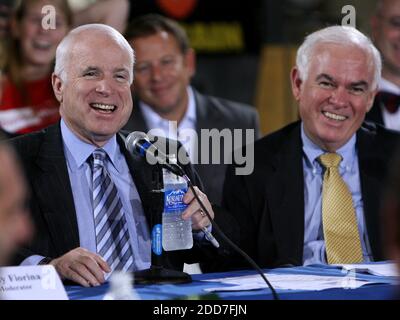 NO FILM, NO VIDEO, NO TV, NO DOCUMENTARY - Republican presidential contender Sen. John McCain laughs with Orange mayor Rich Crotty (right) at Baker Manufacturing while participating in a roundtable discussion with community, business and elected leaders at the company's plant in Orlando, FL, USA on January 23, 2008. Photo by Joe Burbank/Orlando Sentinel/MCT/ABACAPRESS.COM