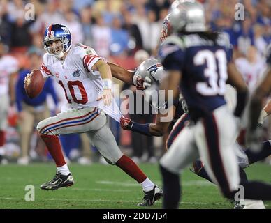 New York Giants receiver David Tyree (85) hauls in a long pass against the  New England Patriots' Rodney Harrison (37) on the game-winning drive in a  17-14 victory over the New England