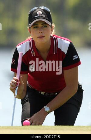 Paula Creamer lines up her putt on the first hole during the first