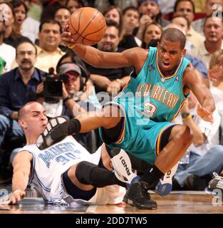 The Orlando Magic's Carlos Arroyo (left) draws the foul from the New Orleans Hornets' Chris Paul during first half action at Amway Arena in Orlando, FL, USA on April 1, 2008. The Hornets defeated the Magic, 98-97. Photo by Gary W. Green/Orlando Sentinel/MCT/Cameleon/ABACAPRESS.COM Stock Photo