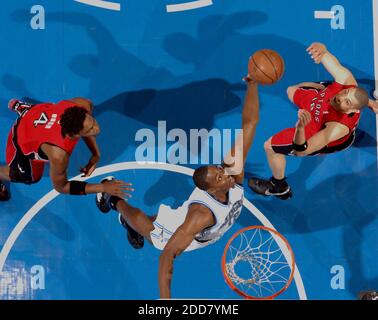 NO FILM, NO VIDEO, NO TV, NO DOCUMENTARY - Orlando Magic's Dwight Howard grabs a rebound over Toronto Raptors' Anthony Parker, right, and Chris Bosh during the first half at Amway Arena in Orlando, FL, USA on April 28, 2008. The Raptors faced the Magic during Game 5 in round one of the NBA Eastern Conference playoffs. Orlando Magic' won 102-92. Photo by Gary W. Green/Orlando Sentinel/MCT/Cameleon/ABACAPRES.COM Stock Photo