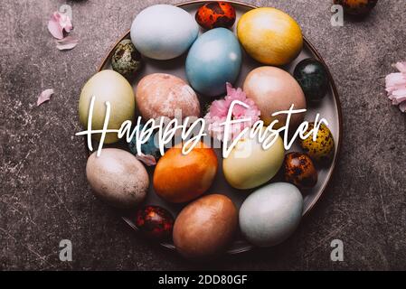 Homemade naturally dyed eggs. Stock Photo
