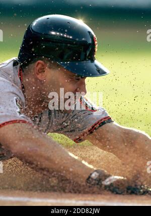 NO FILM, NO VIDEO, NO TV, NO DOCUMENTARY - San Francisco Giants' Omar Vizquel slides head first into first base in the second inning of a game against the Cleveland Indians at Progressive Field in Cleveland, Ohio, USA on June 24, 2008. Photo by Phil Masturzo/Akron Beacon Journal/MCT/Cameleon/ABACAPRESS.COM Stock Photo