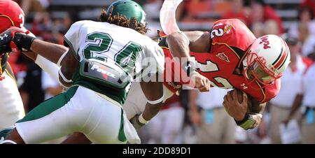 NO FILM, NO VIDEO, NO TV, NO DOCUMENTARY - Maryland quarterback Josh Portis dives forward for extra yardage before being stopped by Eastern Michigan's Dwayne Harrison during the fourth quarter at Byrd Stadium in College Park, MD, USA on September 20, 2008. Photo by Doug Kapustin/Baltimore Sun/MCT/Cameleon/ABACAPRESS.COM Stock Photo