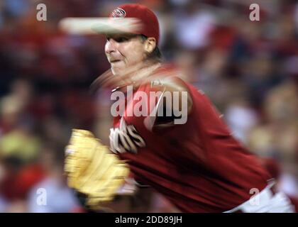 Arizona Diamondbacks pitcher Randy Johnson, right, hugs his