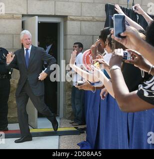 President Bill Clinton waves to his supporters during a campaign stop ...