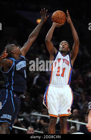 NO FILM, NO VIDEO, NO TV, NO DOCUMENTARY - New York Knicks guard Jamal Crawford (11) shoots a jump shot over the reaching arms of Utah Jazz guard Ronnie Brewer (9) with center Mehmet Okur (13) looking on in the third quarter at Madison Square Garden in New York City, NY, USA on November 9, 2008. Photo by J. Conrad Williams Jr./Newsday/MCT/Cameleon/ABACAPRESS.COM Stock Photo