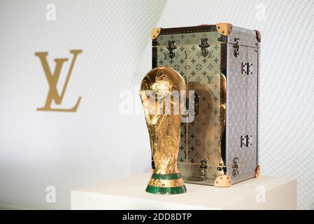 Former French football player Frank Leboeuf, Louis Vuitton's CEO Michael  Burke, FIFA chief Commercial officer Philippe le Floc'h and Russian model  Natalia Vodianova pose with the FIFA Russia 2018 World Cup trophy