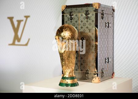 Fans baffled as World Cup trophy arrives in a LOUIS VUITTON case ahead of  the final