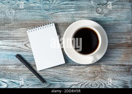 Notepad on a natural gray-blue wooden background. Stock Photo