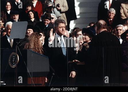NO FILM, NO VIDEO, NO TV, NO DOCUMENTARY - Bill Clinton, standing between Hillary Rodham Clinton and Chelsea Clinton, takes the oath of office of President of the United States at the U.S. Capitol in Washington, D.C., USA on January 20, 1993. Photo by White House/Library of Congress/MCT/ABACAPRESS.COM Stock Photo