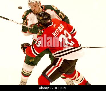 NO FILM, NO VIDEO, NO TV, NO DOCUMENTARY - Chicago Blackhawks Dustin Byfuglien collides with the Minnesota Wild Cal Clutterbuck during the first period at the United Center in Chicago, IL, USA on January 19, 2009. Photo by Nuccio DiNuzzo/Chicago Tribune/MCT/Cameleon/ABACAPRESS.COM Stock Photo