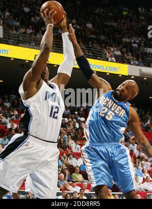 NO FILM, NO VIDEO, NO TV, NO DOCUMENTARY - Orlando Magic center Dwight Howard (12) pulls down a rebound over Denver Nuggets guard Anthony Carter during game action at Amway Arena in Orlando, FL, USA on February 11, 2009. The Nuggets defeated the Magic, 82-73. Photo by Stephen M. Dowell/Orlando Sentinel/Cameleon/ABACAPRESS.COM Stock Photo