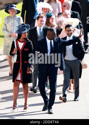 epa06748863 British actor Idris Elba (C) with Sabrina Dhowre (L) arrive for the royal wedding ceremony of Britain's Prince Harry and Meghan Markle at St George's Chapel in Windsor Castle, in Windsor, Britain, 19 May 2018. Photo by Lauren Hurley/ABACAPRESS;COM Stock Photo