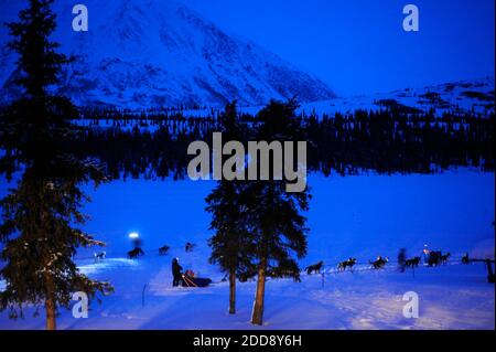 Mushers Kim Darst, front, and Rob Loveman pause to redirect their teams ...