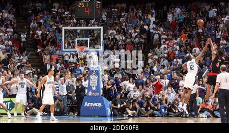 NO FILM, NO VIDEO, NO TV, NO DOCUMENTARY - Toronto Raptors forward Chris Bosh, right, drops a three-point shot over Orlando Magic center Dwight Howard with 25 seconds remaining in game at Amway Arena in Orlando, FL, USA on April 1, 2009. The Raptors defeated the Magic, 99-95. Photo by Gary W. Green/Orlando Sentinel/MCT/Cameleon/ABACAPRESS.COM Stock Photo