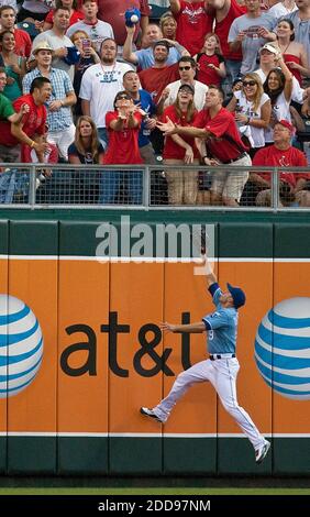 NO FILM, NO VIDEO, NO TV, NO DOCUMENTARY - Kansas City Royals left fielder David DeJesus (9) scaled the wall but can't get to a three-run home run ball hit by the St. Louis Cardinals' Khalil Greene in the ninth inning. The Cardinals defeated the Royals, 7-1, at Kauffman Stadium in Kansas City, MO, USA on June 20, 2009. Photo by John Sleezer/Kansas City Star/MCT/Cameleon/ABACAPRESS.COM Stock Photo