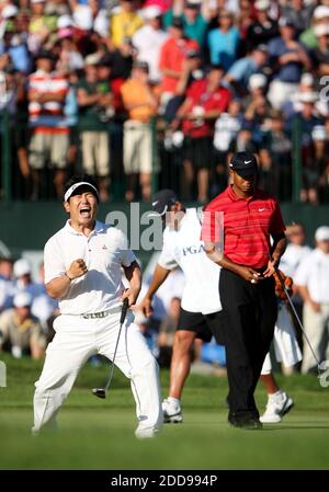 NO FILM, NO VIDEO, NO TV, NO DOCUMENTARY - Y.E. Yang celebrates after his birdie putt on hole the 18th hole gave him the PGA Championship title at Hazeltine National Golf Club in Chaska, MN, USA on August 16, 2009. At right is Tiger Woods, who finished second. Photo by Jeff Wheeler/Minneapolis Star Tribune/MCT/Cameleon/ABACAPRESS.COM Stock Photo
