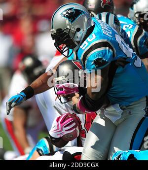 NO FILM, NO VIDEO, NO TV, NO DOCUMENTARY - Carolina Panthers defensive end Julius Peppers (90) wraps up Tampa Bay Buccaneers running back Carnell Williams (24) during first-quarter action at Raymond James Stadium in Tampa, FL, USA on October 18, 2009. The Panthers defeated the Buccaneers, 28-21. Photo by Jeff Siner/Charlotte Observer/MCT/Cameleon/ABACAPRESS.COM Stock Photo