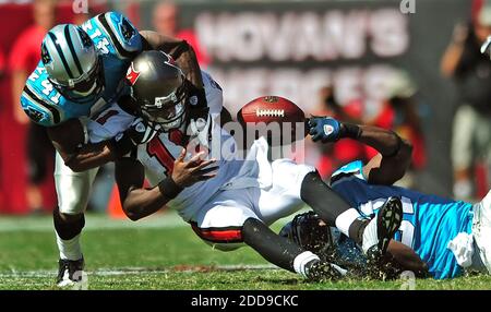 NO FILM, NO VIDEO, NO TV, NO DOCUMENTARY - Carolina Panthers cornerback Captain Munnerlyn (41) and defensive end Everette Brown (91) tackle Tampa Bay Buccaneers quarterback Josh Johnson (11) during third-quarter action at Raymond James Stadium in Tampa, FL, USA on October 18, 2009. The Panthers defeated the Buccaneers, 28-21. Photo by Jeff Siner/Charlotte Observer/MCT/Cameleon/ABACAPRESS.COM Stock Photo