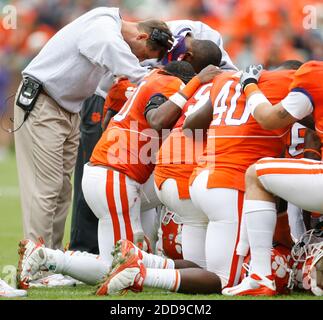 Clemson head coach Dabo Swinney, center, walks on the field after an ...