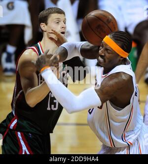 NO FILM, NO VIDEO, NO TV, NO DOCUMENTARY - Milwaukee Bucks guard Luke Ridnour (13) tries to gain control of the ball from Charlotte Bobcats forward Gerald Wallace (3) during first-half action at Time Warner Cable Arena in Charlotte, NC, USA on December 28, 2009. Photo by Jeff Siner/Charlotte Observer/MCT/Cameleon/ABACAPRESS.COM Stock Photo