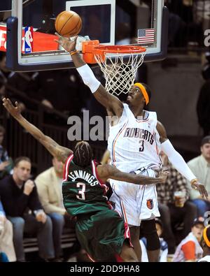 NO FILM, NO VIDEO, NO TV, NO DOCUMENTARY - Charlotte Bobcats forward Gerald Wallace (3) attempts to block a shot by Milwaukee Bucks guard Brandon Jennings (3) during second-half action at Time Warner Cable Arena in Charlotte, NC, USA on December 28, 2009. Photo by Jeff Siner/Charlotte Observer/MCT/Cameleon/ABACAPRESS.COM Stock Photo