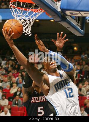 Atlanta Hawks' Josh Smith scores as Indiana Pacers' Brandon Rush ...