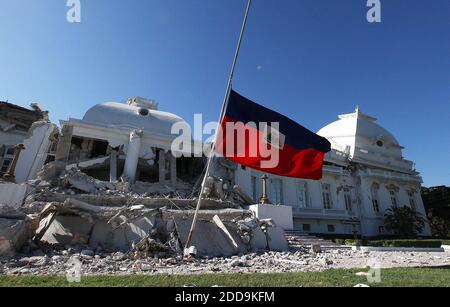 NO FILM, NO VIDEO, NO TV, NO DOCUMENTARY - Rotor wash from Navy helicopters evacuating victims cause the large flag in front of the Haitian Presidential Palace to wave. Thursday, January 21, 2010, in Port-au-Prince, Haiti. The flag was on top of the destroyed building before the earthquake. Photo by Chuck Liddy/Raleigh News & Observer/MCT/ABACAPRESS.COM Stock Photo