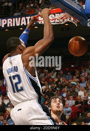 NO FILM, NO VIDEO, NO TV, NO DOCUMENTARY - Orlando Magic center Dwight Howard slam dunks over Milwaukee Bucks center Andrew Bogut during an NBA game at Amway Arena in Orlando, FL, USA on February 2, 2010. Photo by Stephen M. Dowell/Orlando Sentinel/MCT/Cameleon/ABACAPRESS.COM Stock Photo