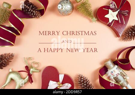 Luxury Christmas background with on trend fashionable stylish coral, deep red and gold gifts and decorations. Top view creative composition flat lay. Stock Photo