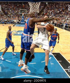 NO FILM, NO VIDEO, NO TV, NO DOCUMENTARY - Orlando Magic guard J.J. Redick (7) gets fouled by Cleveland Cavaliers center Shaquille O'Neal (33) during game action at Amway Arena in Orlando, Florida, Sunday, February 21, 2010. The Magic defeated the Cavaliers, 101-95. Photo by Gary W. Green/Orlando Sentinel/MCT/Cameleon/ABACAPRESS.COM Stock Photo