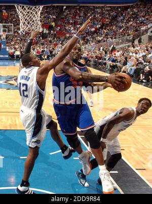 NO FILM, NO VIDEO, NO TV, NO DOCUMENTARY - Cleveland Cavaliers center Shaquille O'Neal (33) drives between Orlando Magic center Dwight Howard (12) and forward Mickael Pietrus (20) during game action at Amway Arena in Orlando, Florida, Sunday, February 21, 2010. The Magic defeated the Cavaliers, 101-95. Photo by Gary W. Green/Orlando Sentinel/MCT/Cameleon/ABACAPRESS.COM Stock Photo