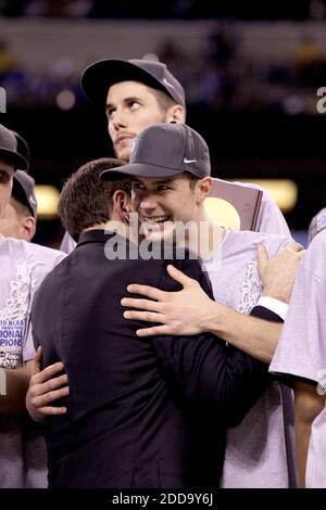 NO FILM, NO VIDEO, NO TV, NO DOCUMENTARY - Jon Scheyer of Duke (30) hugs Duke head coach Mike Krzyzewski following a 61-59 victory over Butler in the NCAA Final Four championship game at Lucas Oil Stadium in Indianapolis, IN, USA on April 5, 2010. Photo by Mark Cornelison/Lexington Herald-Leader/MCT/Cameleon/ABACAPRESS.COM Stock Photo