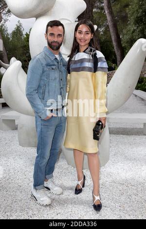 Urassaya Sperbund and designer Nicolas Ghesquiere pose for