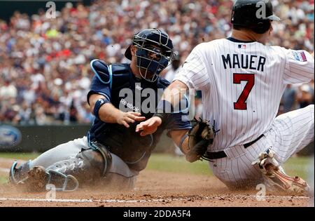 21 August 2009: Minnesota Twins catcher Joe Mauer (7) awarded 1st base  after his second intentional walk during Friday's baseball game, the  Minnesota Twins defeated the Kansas City Royals 5-4 in 10