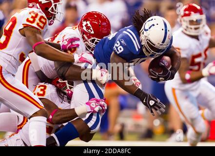 NO FILM, NO VIDEO, NO TV, NO DOCUMENTARY - Kansas City Chiefs defensive players Brandon Carr, left, Glenn Dorsey and Kendrick Lewis (23) stop Indianapolis Colts running back Joseph Addai in the first quarter during the NFL American Football match, Indianapolis Colts vs Kansas City Chiefs at Lucas Oil Stadium in Indianapolis, IN, USA on October 10, 2010. The Colts won 19-9. Photo by David Eulitt/Kansas City Star/MCT/Cameleon/ABACAPRESS.COM Stock Photo