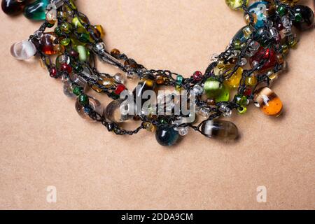 handcrafted necklace. String of beads in various colors. Colorful beads necklaces. Stock Photo