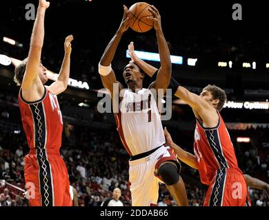 NO FILM, NO VIDEO, NO TV, NO DOCUMENTARY - Miami Heat forward Chris Bosh, middle, drives past New Jersey Nets forward Troy Murphy, left, and center Brook Lopez during the first half of NBA action at the American Airlines Arena in Miami, FL, USA on November 6, 2010. The Heat topped the Nets, 101-89. Photo by Michael Laughlin/South Florida Sun Sentinel/MCT/ABACAPRESS.COM Stock Photo