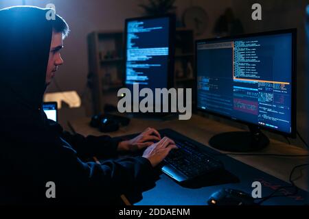 Young man using computer while working at table Stock Photo