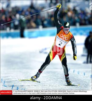 NO FILM, NO VIDEO, NO TV, NO DOCUMENTARY - © Joe Rimkus/KRT/ABACA. 32306-5. Salt Lake City-UT-USA, 09/02/2002. Spain's Johann Muehlegg celebrates his win in the men's 30K freestyle cross country race at Soldier Hollow. Stock Photo