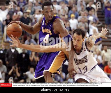 NO FILM, NO VIDEO, NO TV, NO DOCUMENTARY - © Chris Carlson/KRT/ABACA.  34838-2. Sacramento-CA-USA, 18/05/2002. Lakers' Kobe Bryant (8) is fouled  by Sacramento's Doug Christie (13) during Los Angeles' 106-99 victory over