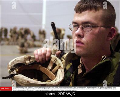 NO FILM, NO VIDEO, NO TV, NO DOCUMENTARY - © John Fitzhugh/KRT/ABACA. 44078-2. Gulfport-Mississippi-USA, 28/03/2003. Builder constructionman Thomas Clifton of Shoals, Indiana, waits in a hanger at the Mississippi Air National Guard Combat Readiness Training Center to board a plane to the Middle Ea Stock Photo