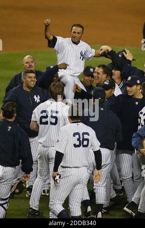 NO FILM, NO VIDEO, NO TV, NO DOCUMENTARY - © Kathy Kmonicek/Newsday/KRT/ABACA. 51354. New York City-NY-USA, 16/10/2003. New York Yankees' relief pitcher Mariano Rivera is carried in the air by his teammates following the Yankees 6-5 victory over the Boston Red Sox in the 11-inning, game seven of t Stock Photo