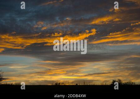 Autmn sky at sunset above a railway embankment, UK Stock Photo